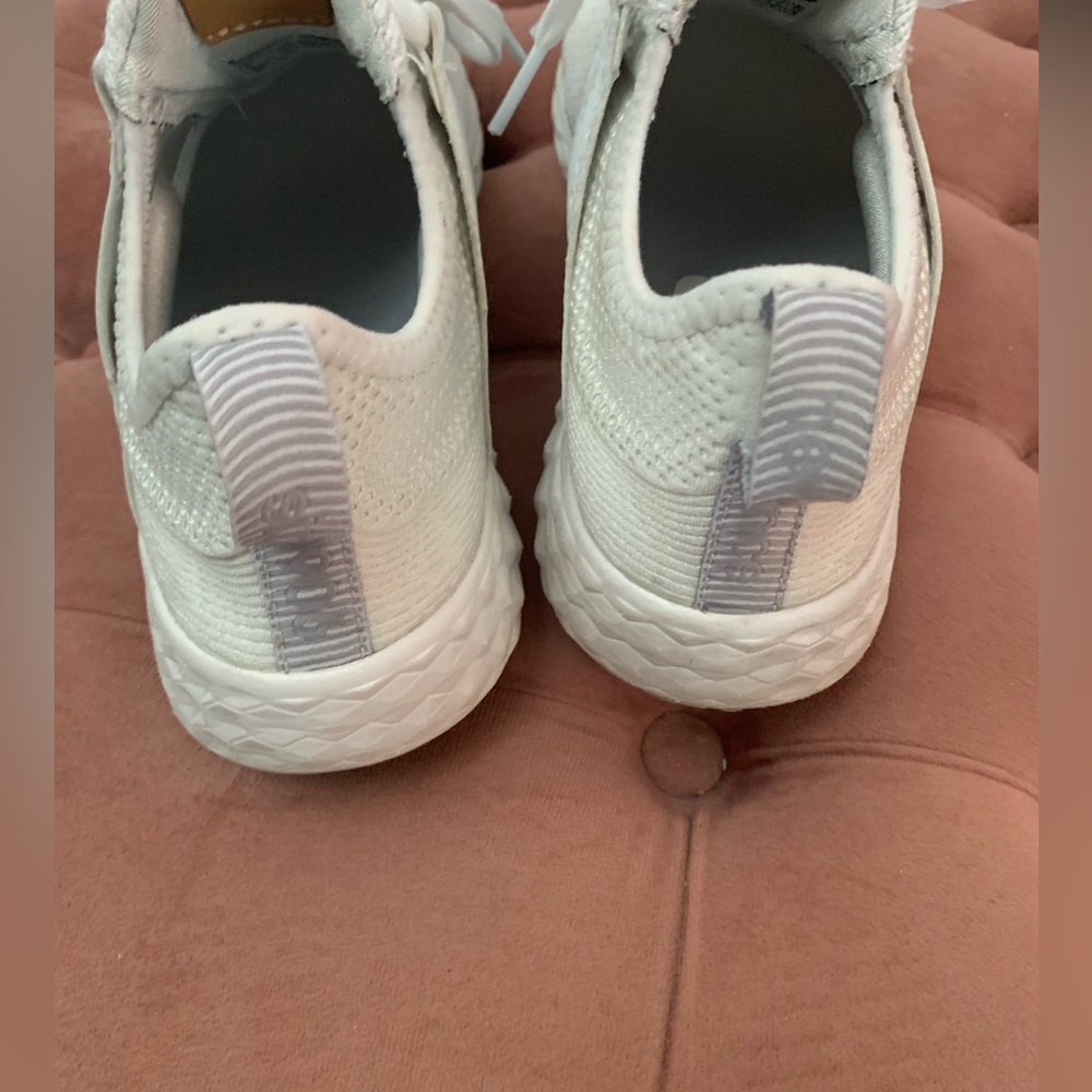 White New Balance tennis shoes. Gently used see the soles. Size 6